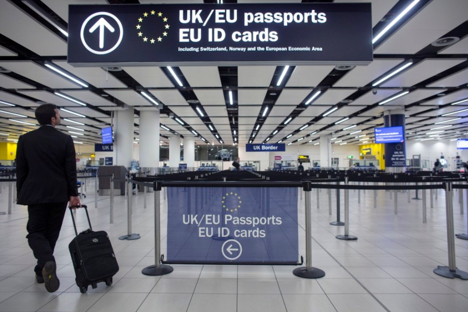 LONDON, ENGLAND - MAY 28: Border Force check the passports of passengers arriving at Gatwick Airport on May 28, 2014 in London, England. Border Force is the law enforcement command within the Home Office responsible for the security of the UK border by enforcing immigration and customs controls on people and goods entering the UK. Border Force officers work at 140 sea and airports across the UK and overseas. (Photo by Oli Scarff/Getty Images)