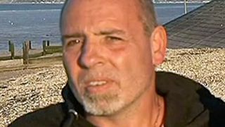 Mark Terry seen during a BBC interview wearing a black hoodie