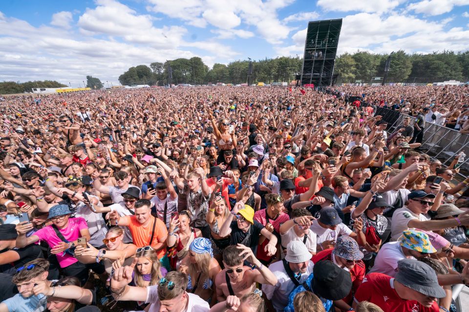a large crowd of people at a music festival