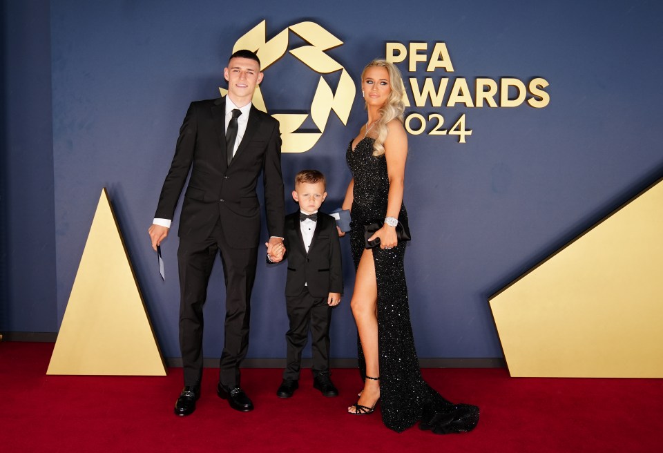 a family poses on the red carpet at the pfa awards