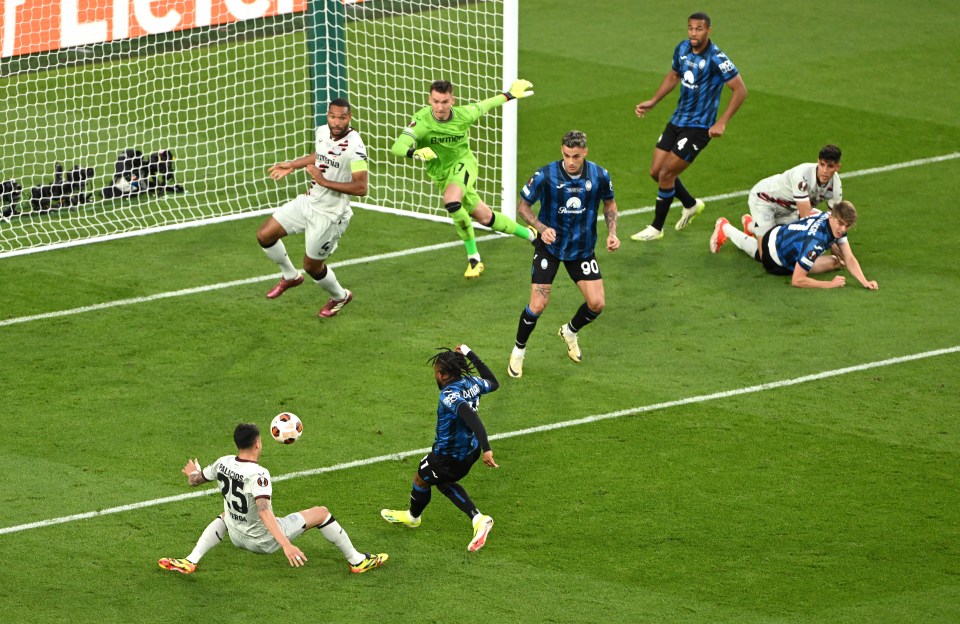 soccer players on a field with one wearing the number 90