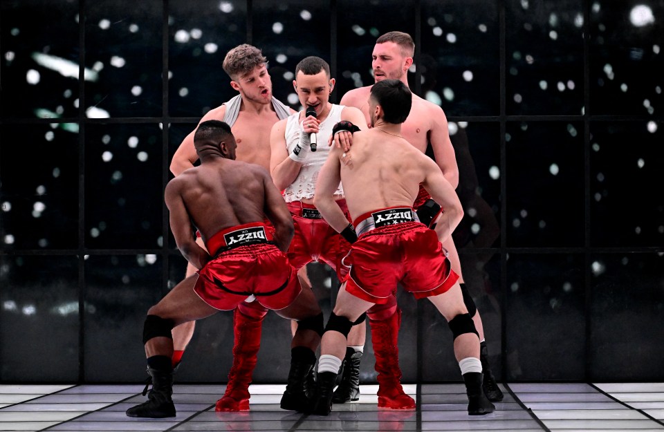 a group of men wearing red shorts that say dizzy on them