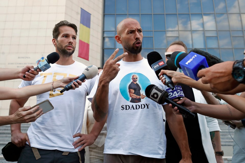 a man wearing a shirt that says sdaddy is being interviewed
