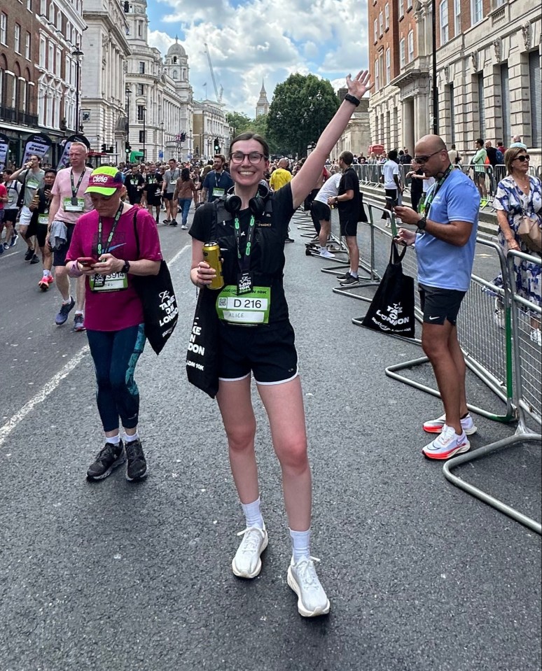 a woman wearing a shirt that says ' marathon ' on it
