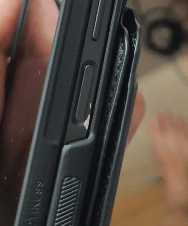 a person is holding a phone with the word hotliness on it