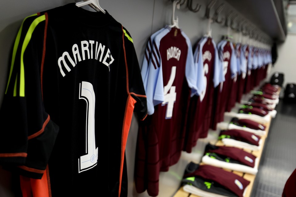 a martinez jersey hangs in a locker room