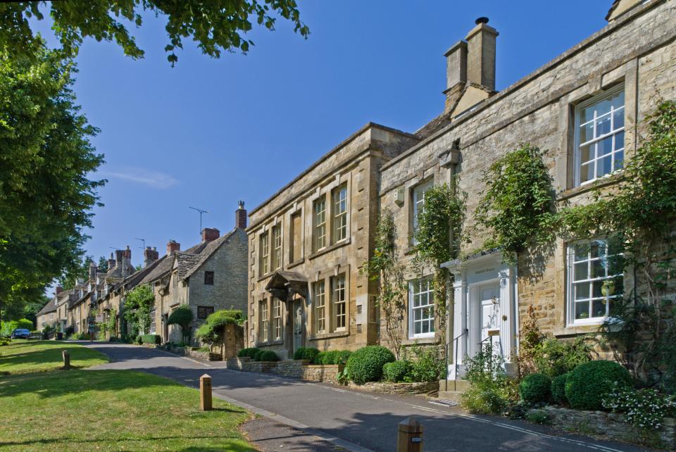 a row of stone houses on a sunny day