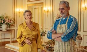 a man and a woman are standing next to each other in a room .