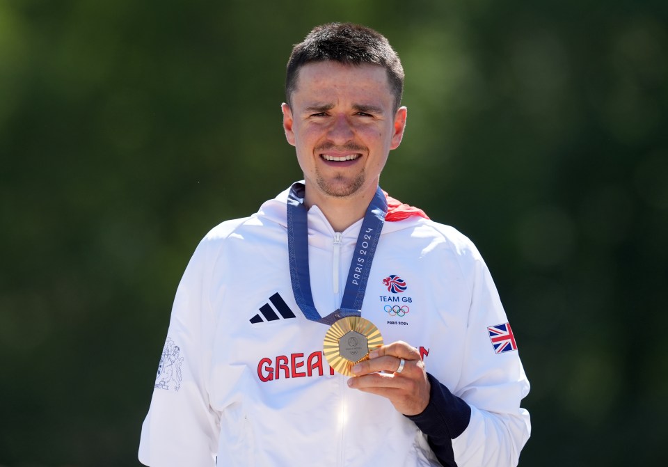 a man wearing a white jacket with the word great on it