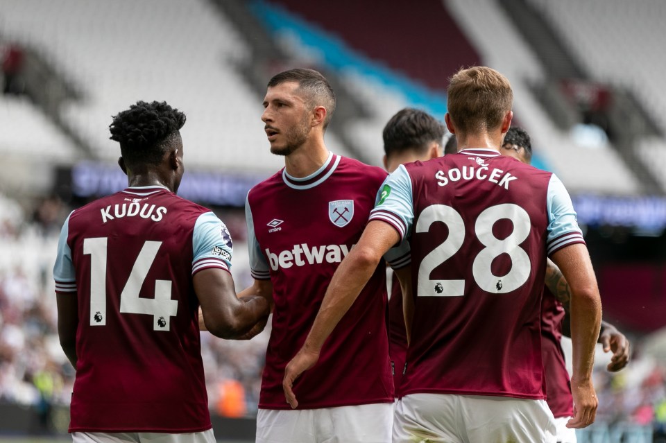 a group of soccer players wearing jerseys that say ' betway ' on them