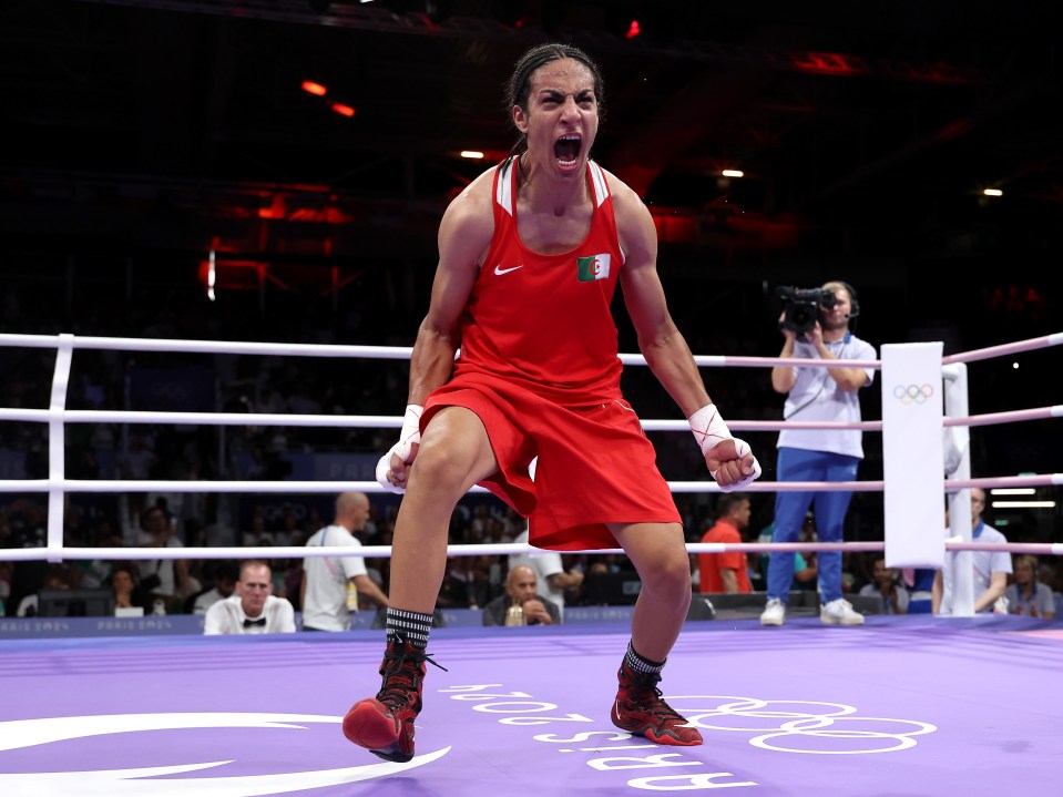 a woman in a boxing ring with the word moscow on the floor