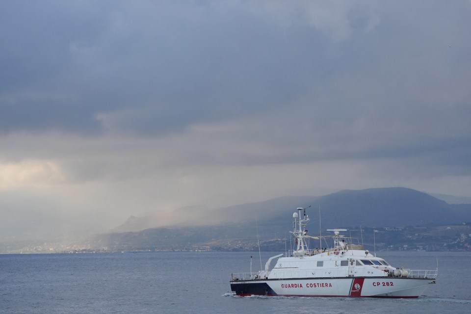 a boat that says guardia costiera on the side