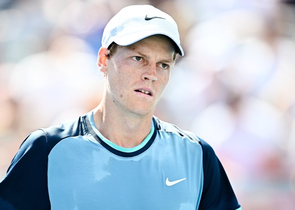 a man wearing a white nike hat and a blue shirt