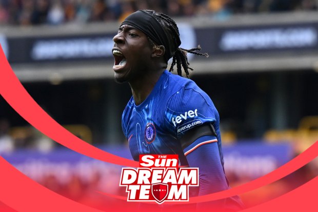 a soccer player wearing a blue jersey that says fever on it