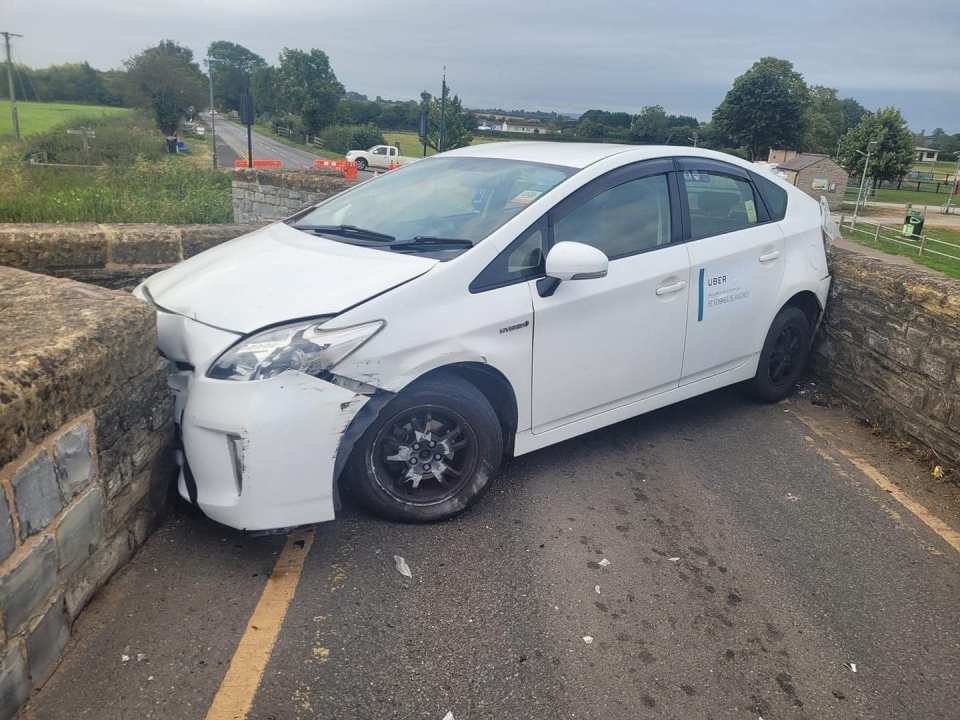a white car with the word uber on the side