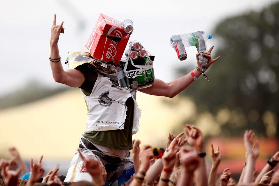 a man wearing a coca cola box on his head