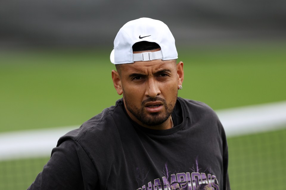 a man wearing a black shirt that says champions on it