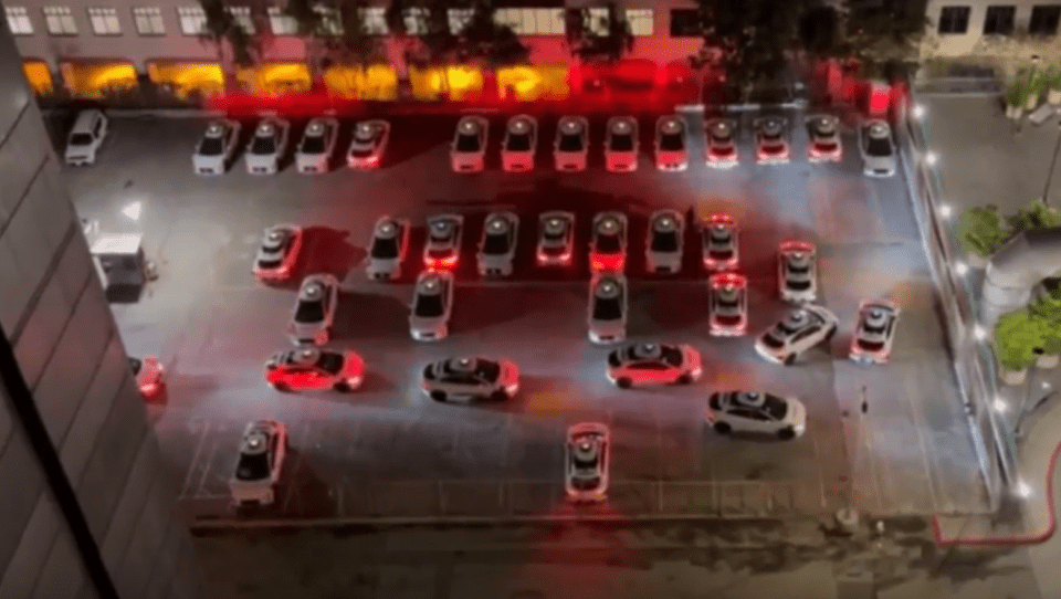 a bunch of cars are parked in a parking lot