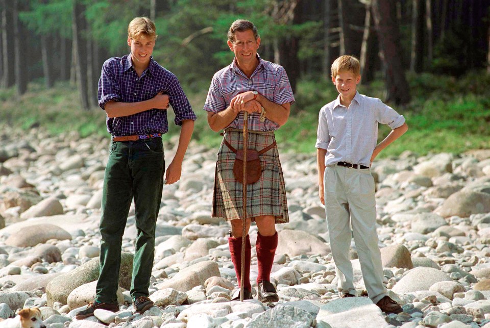 a man in a kilt stands next to two other men
