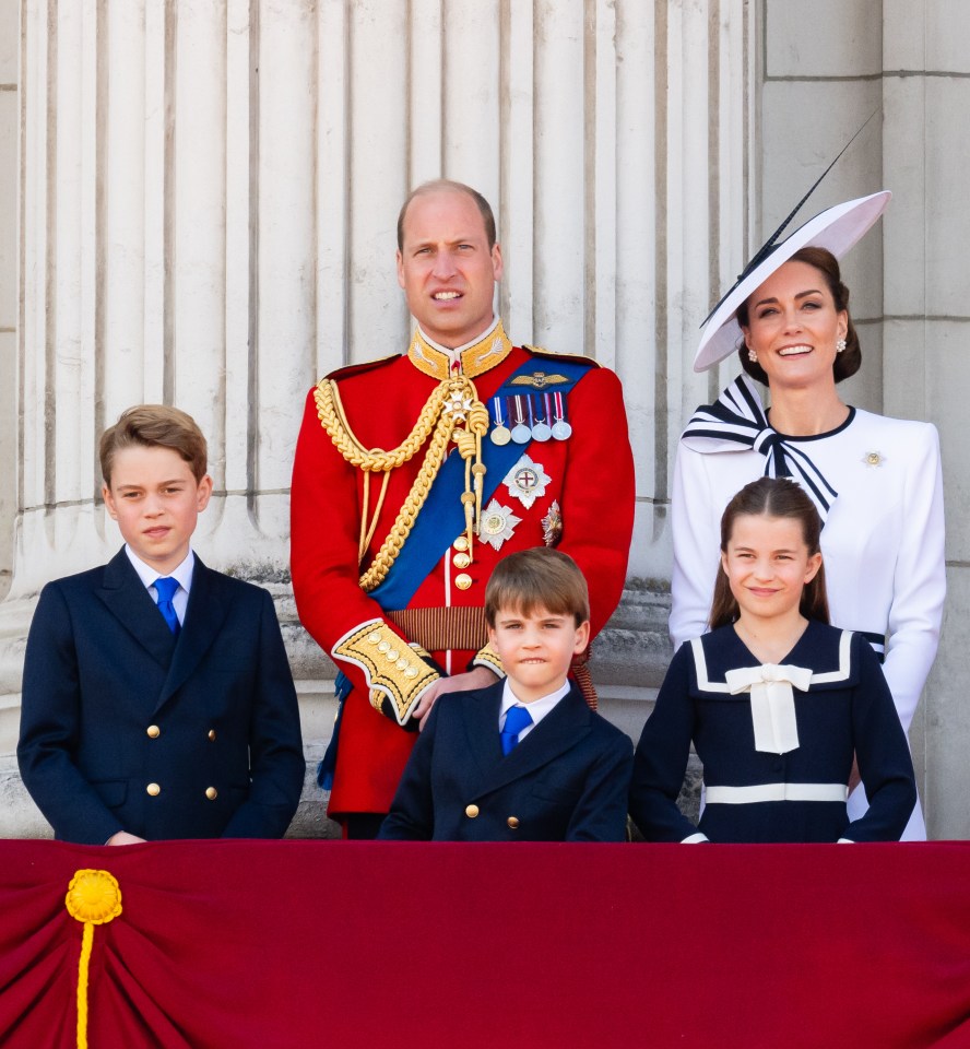 a family posing for a picture with a man in a red uniform with medals on it