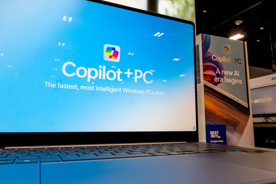 a laptop with the word copilot on the screen