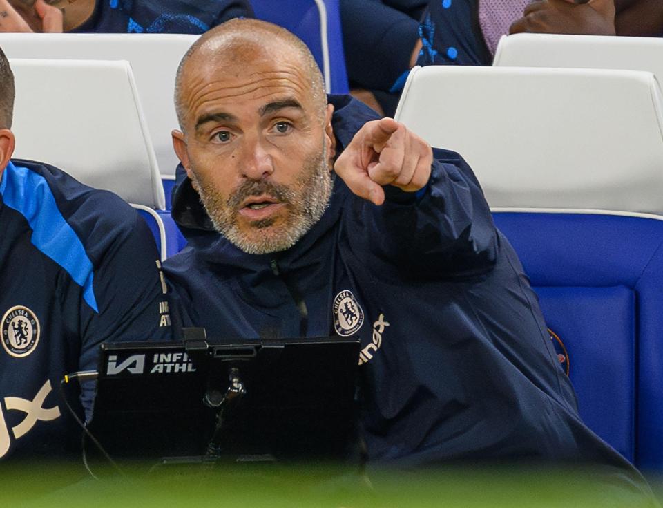 a man wearing a jacket with the word chelsea on it
