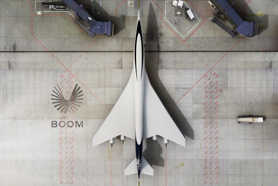 an airplane is parked on a runway with the word boom on the ground