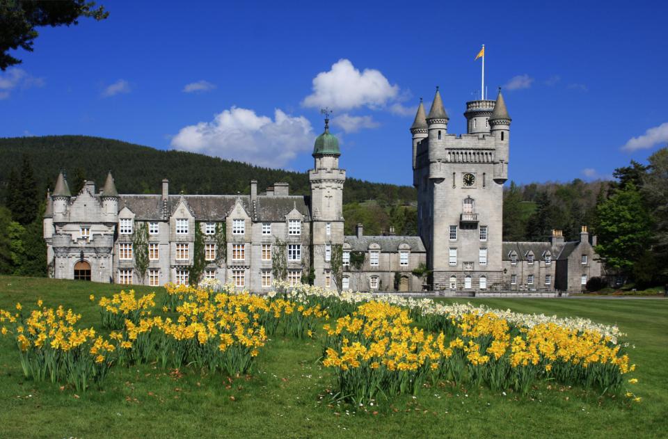 a large castle with a flag on top of it