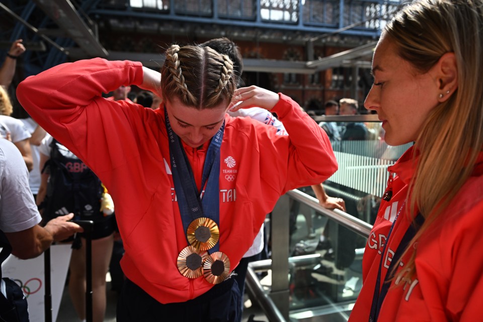a woman wearing a red jacket that says gbr on it