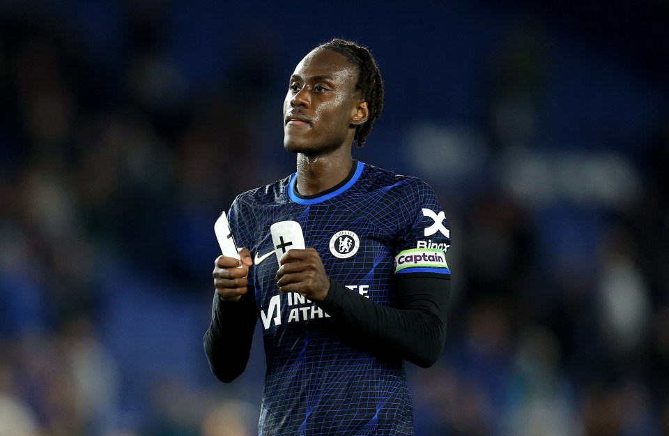 a soccer player wearing a jersey that says captain on it