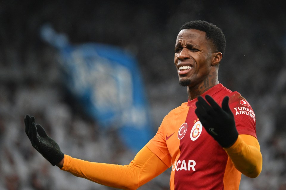 a soccer player wearing a turkish airlines shirt