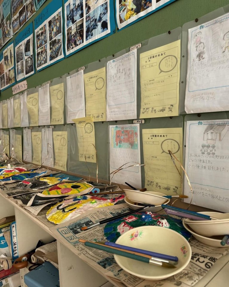 a bunch of papers on a wall with one that says ' a ' on it