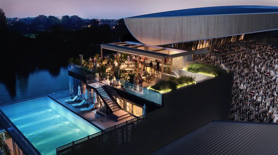 an aerial view of a large building with a swimming pool