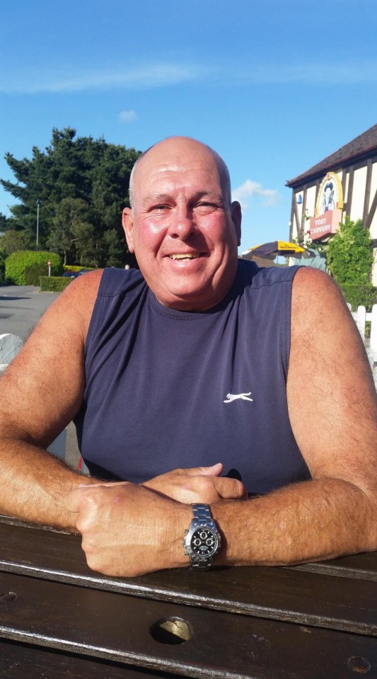 a man wearing a sleeveless shirt with a slazenger logo on it