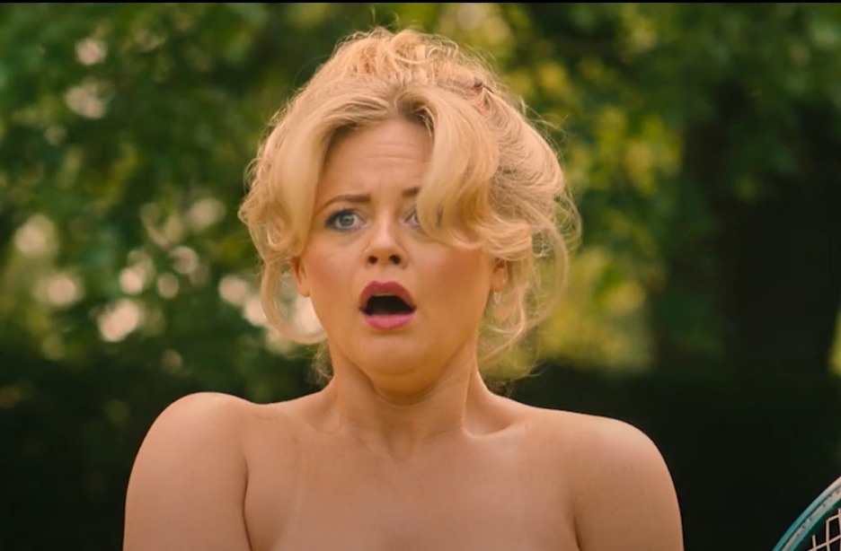 a woman without a shirt is holding a tennis racket