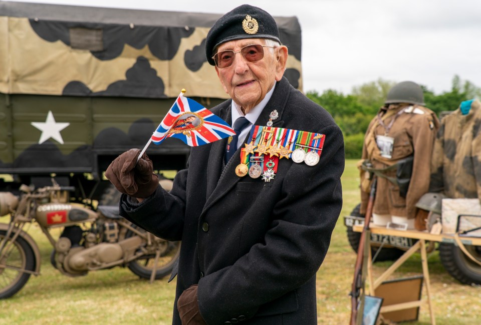 a man holding a flag that says ' united kingdom ' on it