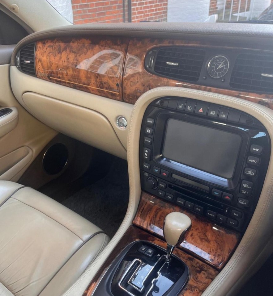 the dashboard of a car with a clock on it