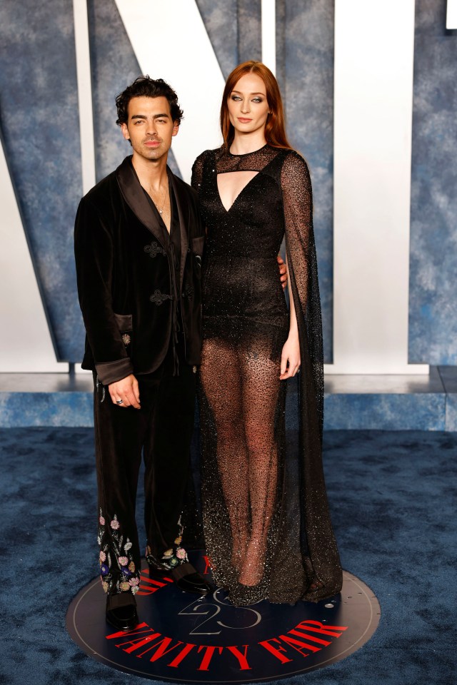 joe jonas and sophie turner pose on the vanity fair carpet