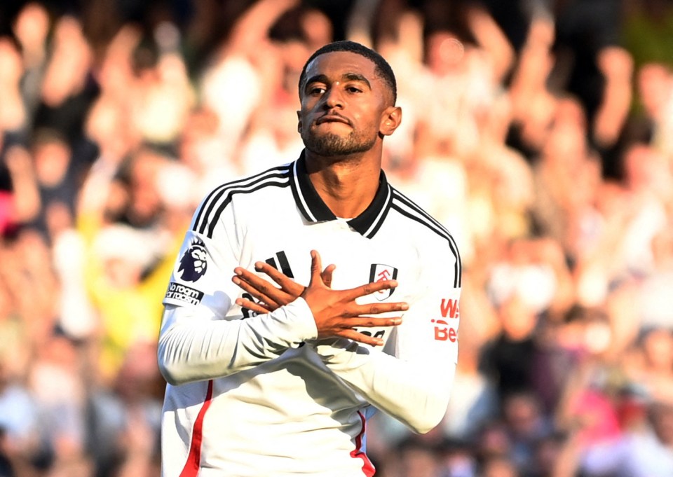 a soccer player wearing a jersey that says ' bwin ' on it