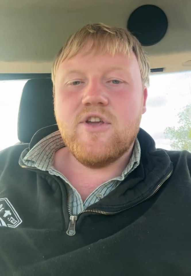 a man with a beard wears a black jacket with the word jeep on it