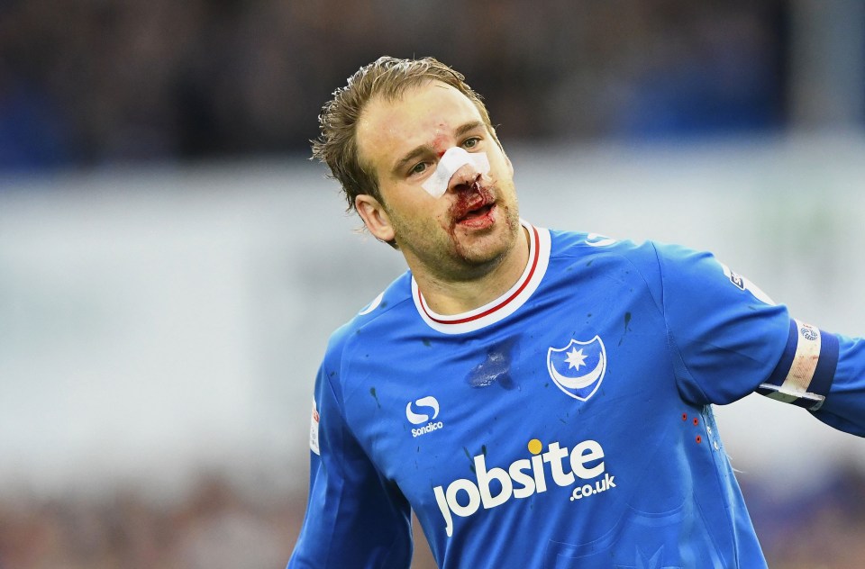 a man wearing a blue jersey with jobsite.co.uk on it
