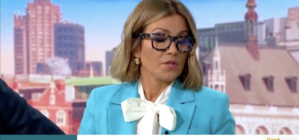 a woman wearing glasses and a blue suit is on a news channel