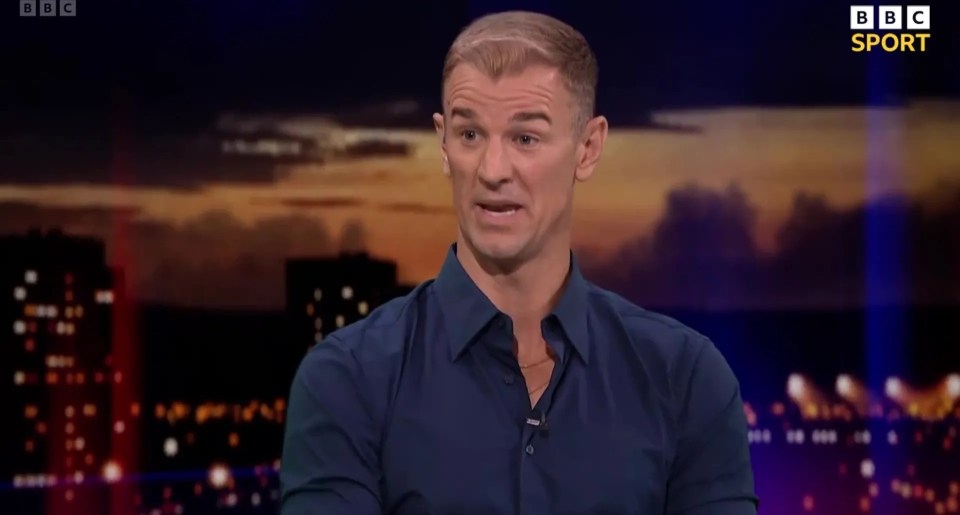 a man in a blue shirt is on a bbc sport show