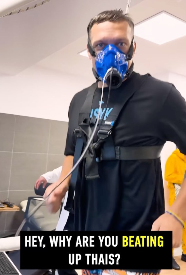 a man wearing a black shirt with the word isvk on it