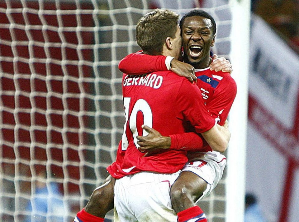 a soccer player with the number 10 on his jersey is hugging another player