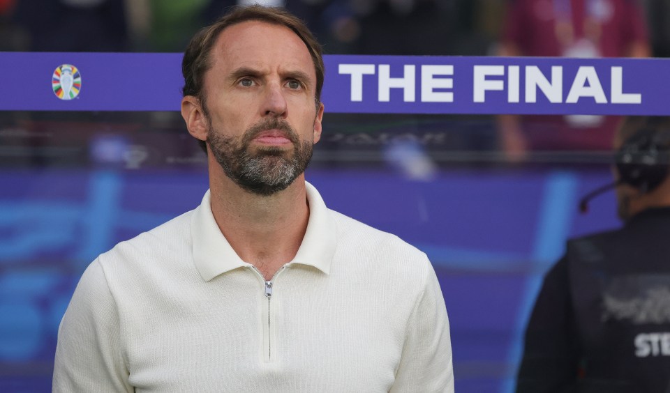 a man stands in front of a sign that says the final