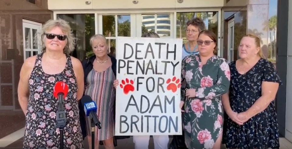 (TAKEN WITHOUT PERMISSION_<br />
UTTER DEPRAVITY Court protesters call for DEATH for worlds worst animal abuser Adam Britton who tortured & raped adopted pet dogs<br />
Pictured: Protestors to Adam Britton outside Darwin supreme court<br />
http://www.ntnews.com.au/news/northern-territory/adam-britton-protest/video/568b2635885a494dee42bd5cf3b27a20