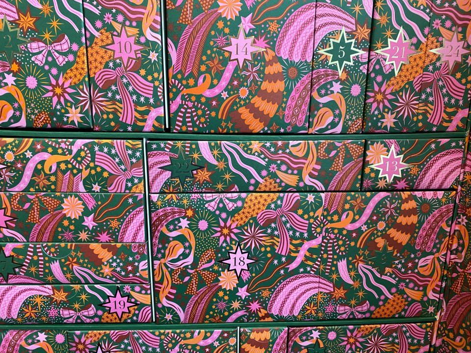 a stack of green and pink boxes with the numbers 10 11 12 and 13 on them