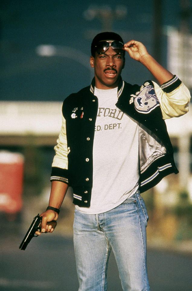 a man wearing a varsity jacket with the word ford on it