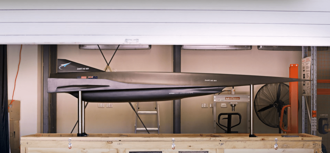 a model of a space shuttle is in a wooden box
